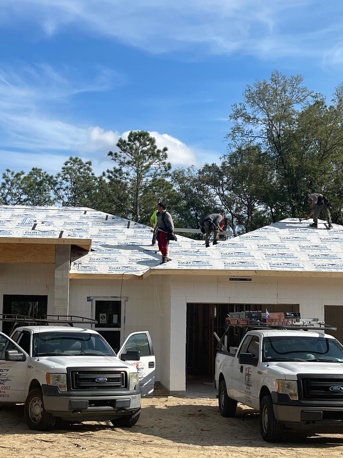 Roofing crew completing the roof structure